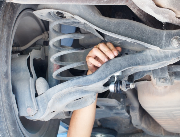 mechanic removing strut