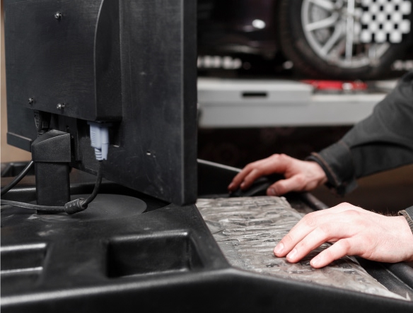 mechanic working on computer diagnostics